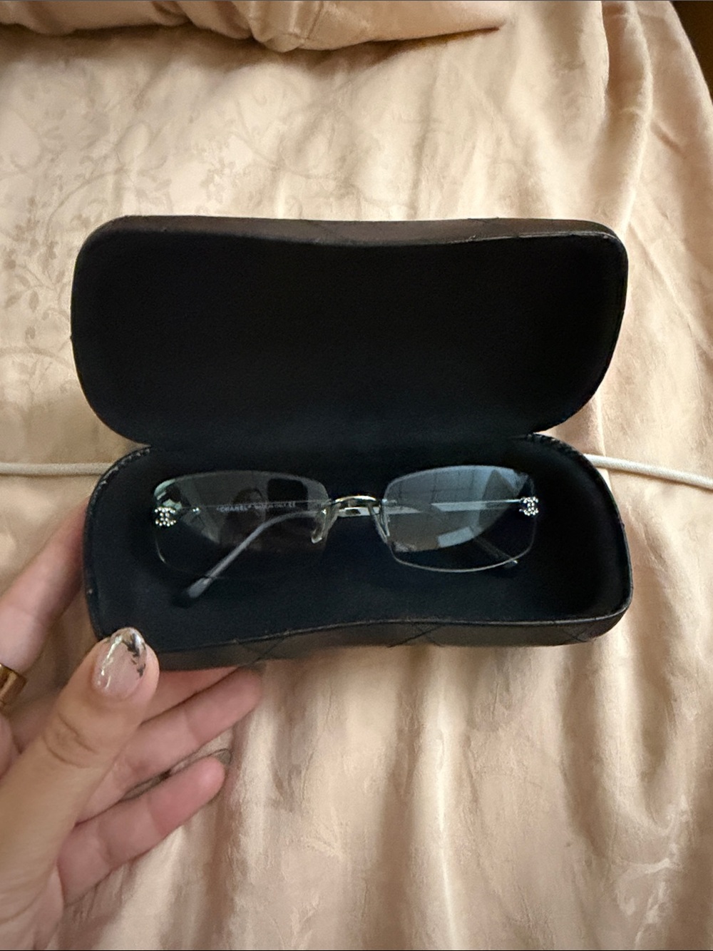 CHANEL Rimless Sunglasses with Black Lenses and Silver Accents